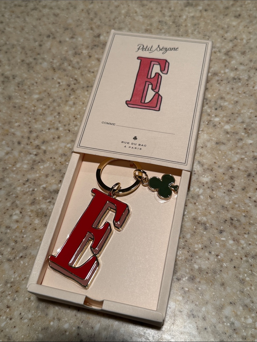 Sézane Red Letter 'E' Keychain with Green Clover Charm